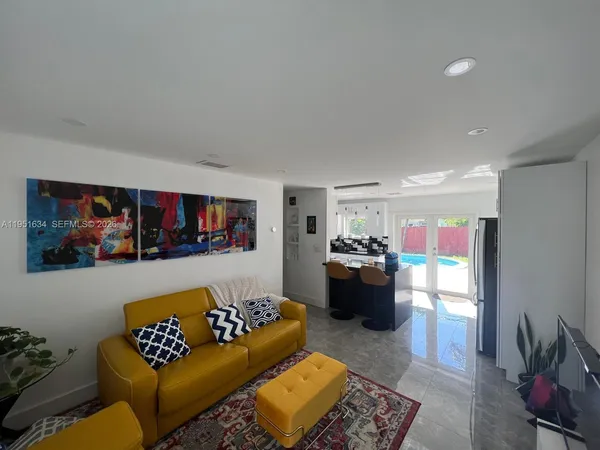 a living room with furniture and a couch