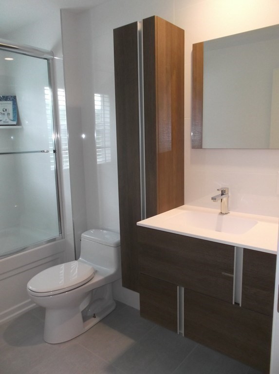 45 Wellesley Road Belmont, MA 02478 - Photo 25 of 39 a bathroom with a sink a toilet and shower