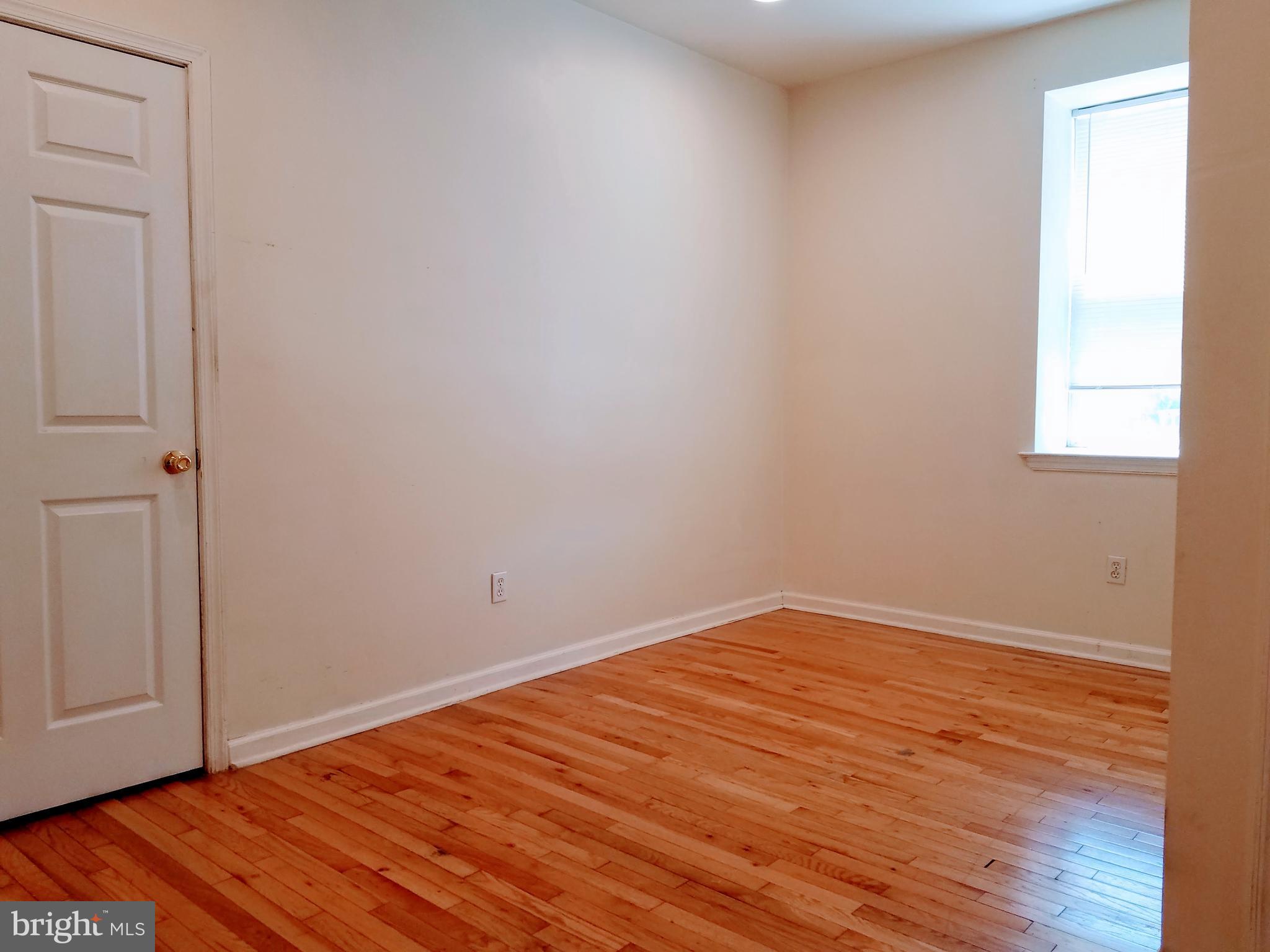1951 South 4th Street, Unit 1 Philadelphia, PA 19148 - Photo 3 of 8 a view of empty room with wooden floor and fan