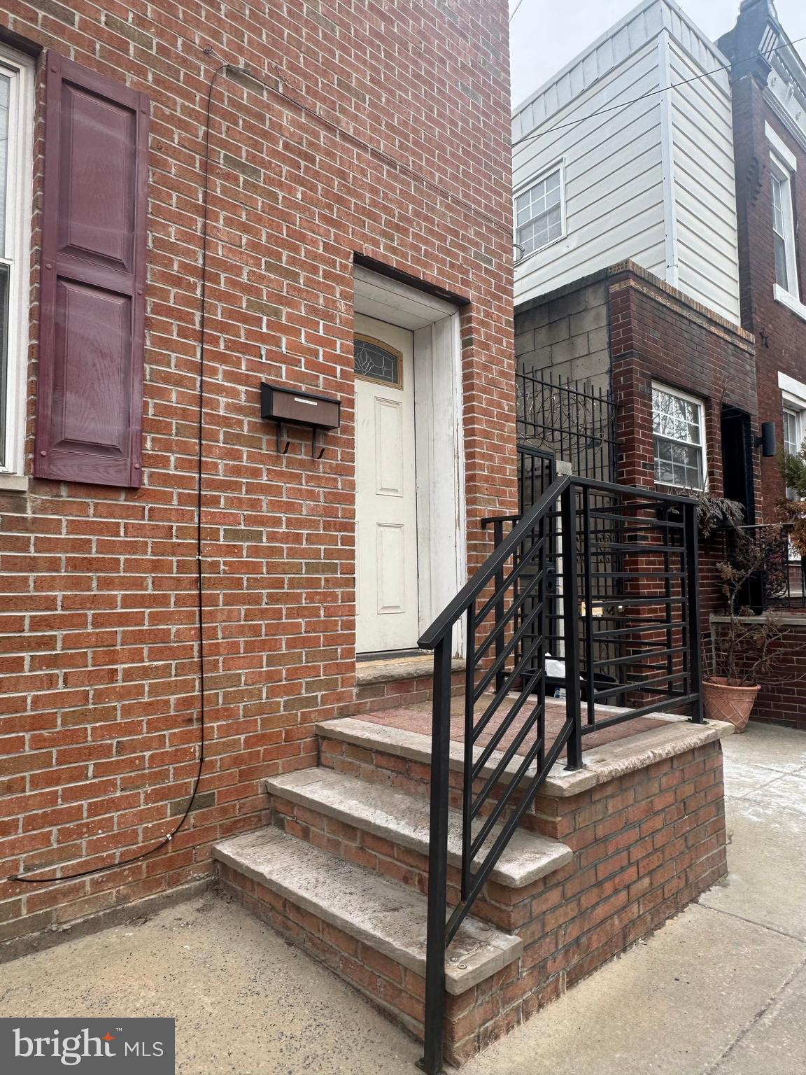 1951 South 4th Street, Unit 1 Philadelphia, PA 19148 - Photo 5 of 8 a view of entryway with a brick wall