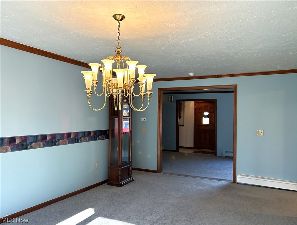 7855 Mulberry Road Chesterland, OH 44026 - Photo 19 of 46 Dining Room with a chandelier and crown molding.