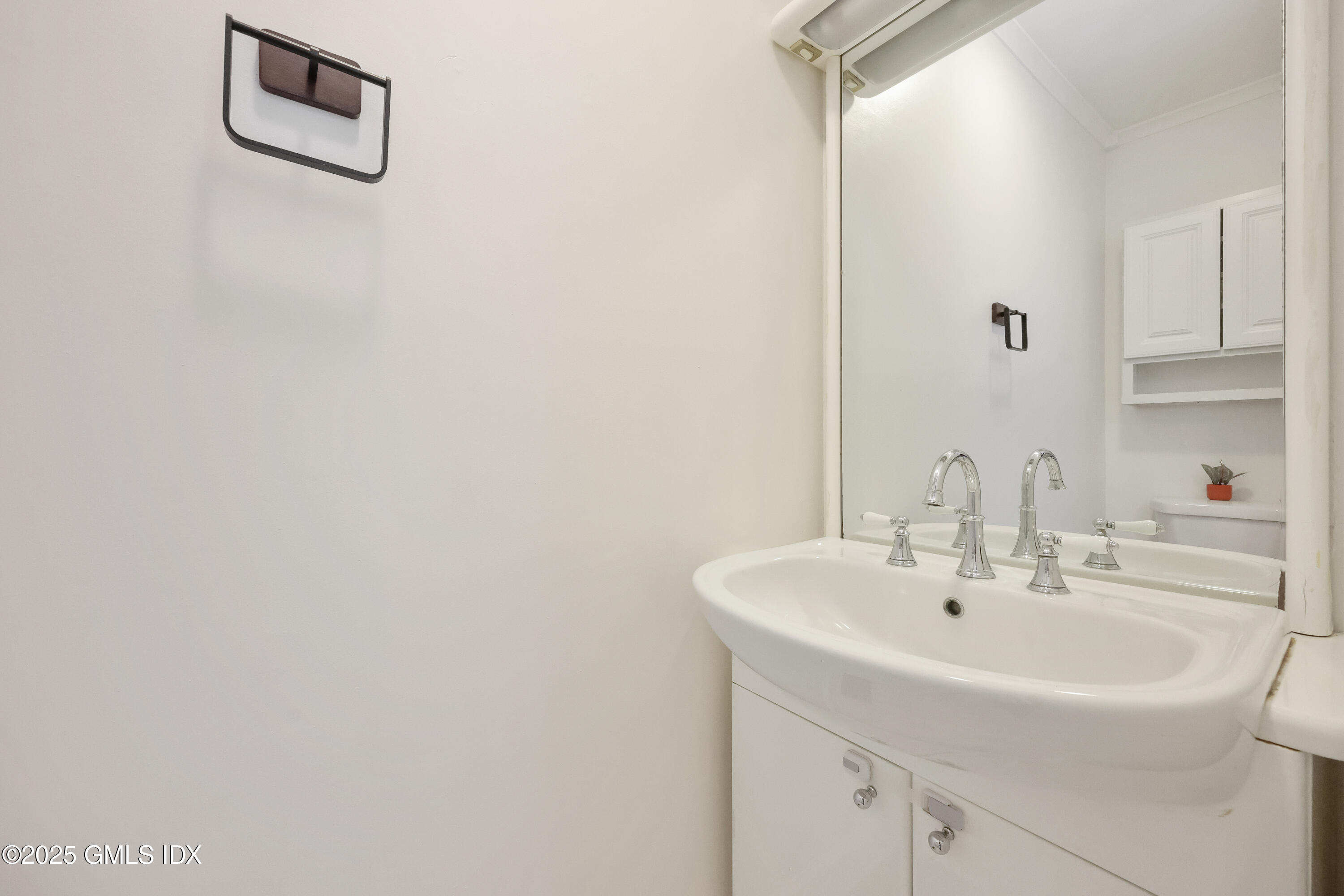 75 Cos Cob Avenue, Unit 14 Cos Cob, CT 06807 - Photo 12 of 28 a bathroom with a sink and a mirror