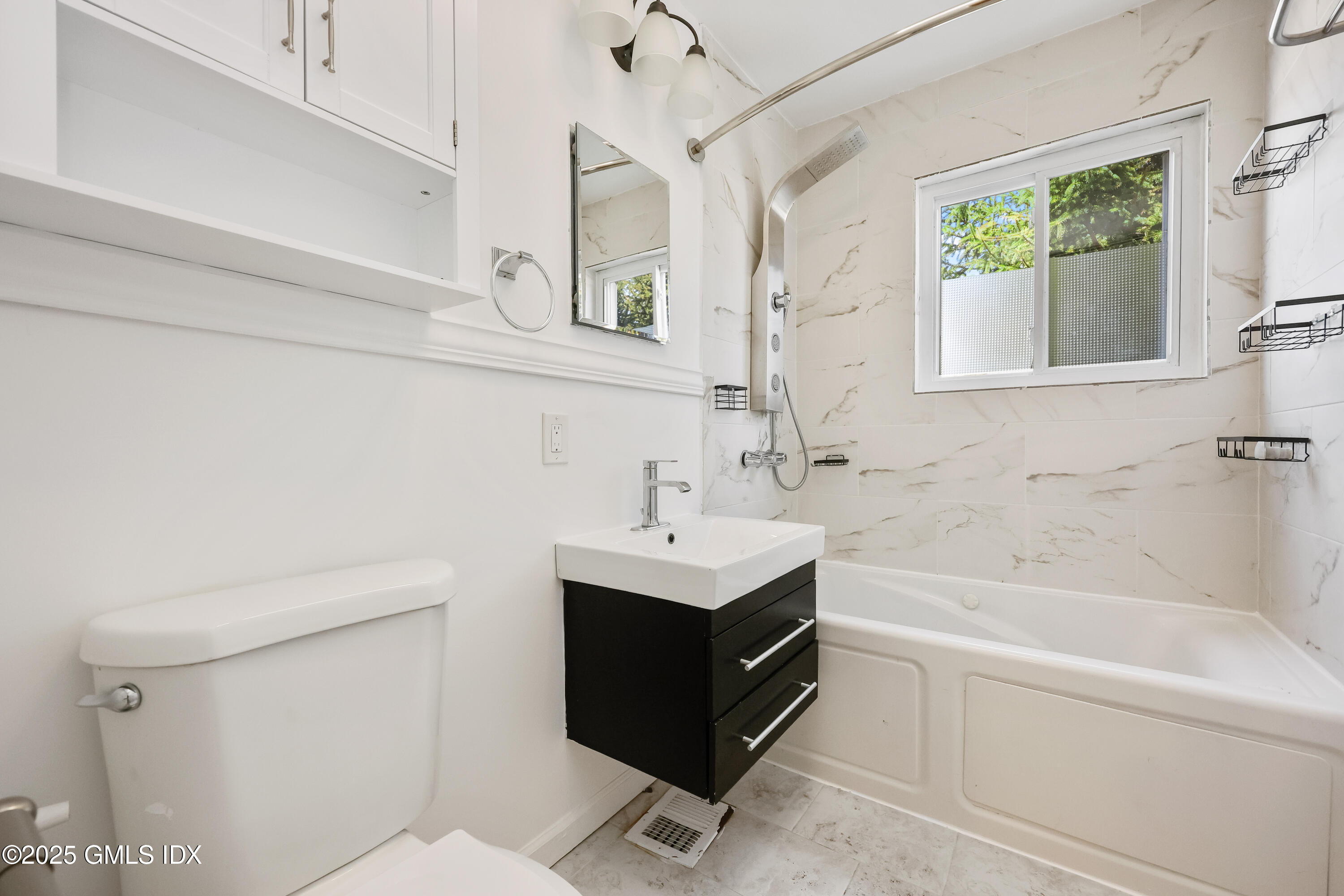 75 Cos Cob Avenue, Unit 14 Cos Cob, CT 06807 - Photo 13 of 28 a bathroom with a sink a toilet and bathtub