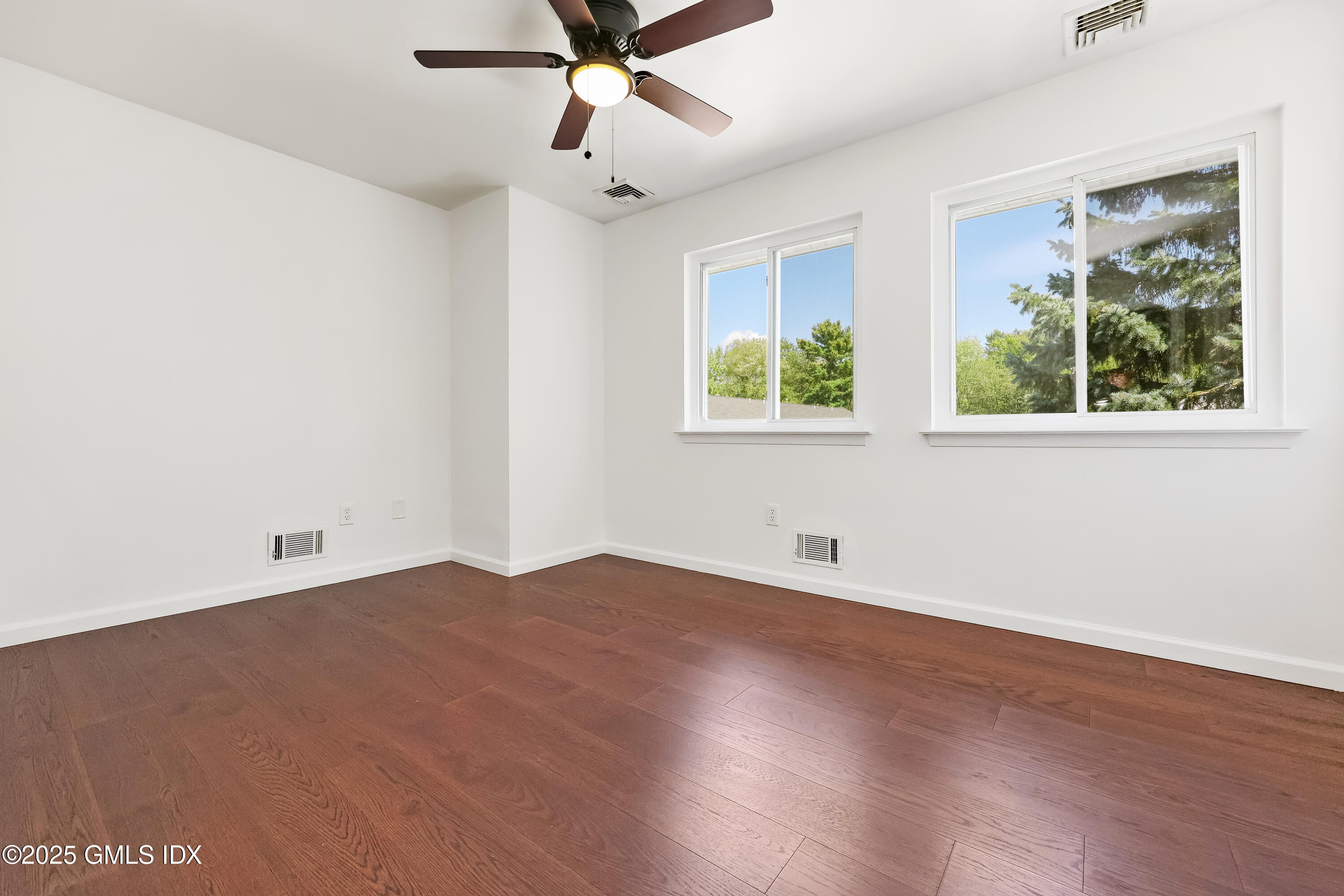 75 Cos Cob Avenue, Unit 14 Cos Cob, CT 06807 - Photo 18 of 28 wooden floor in an empty room with a window