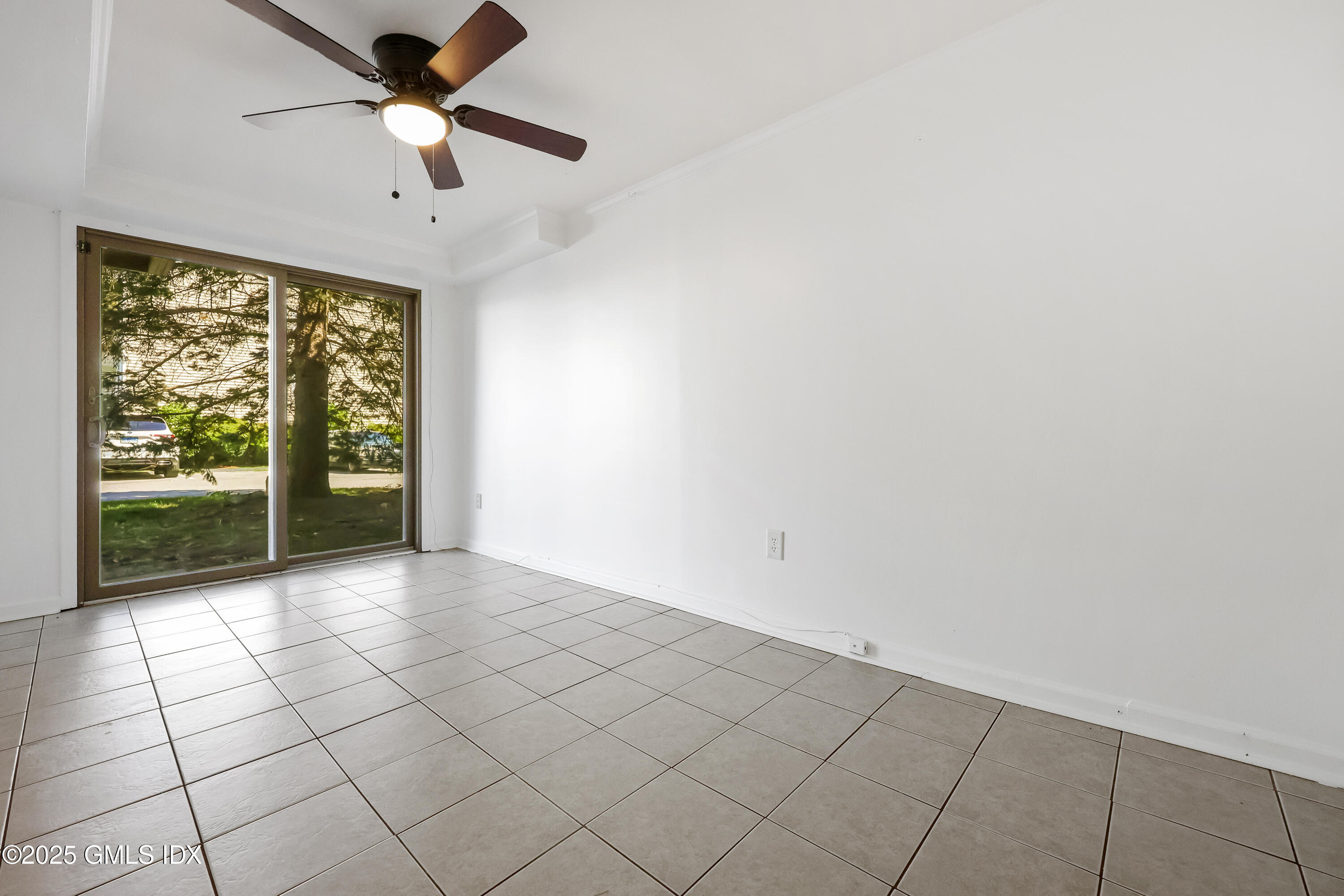 75 Cos Cob Avenue, Unit 14 Cos Cob, CT 06807 - Photo 19 of 28 an empty room with windows and fan