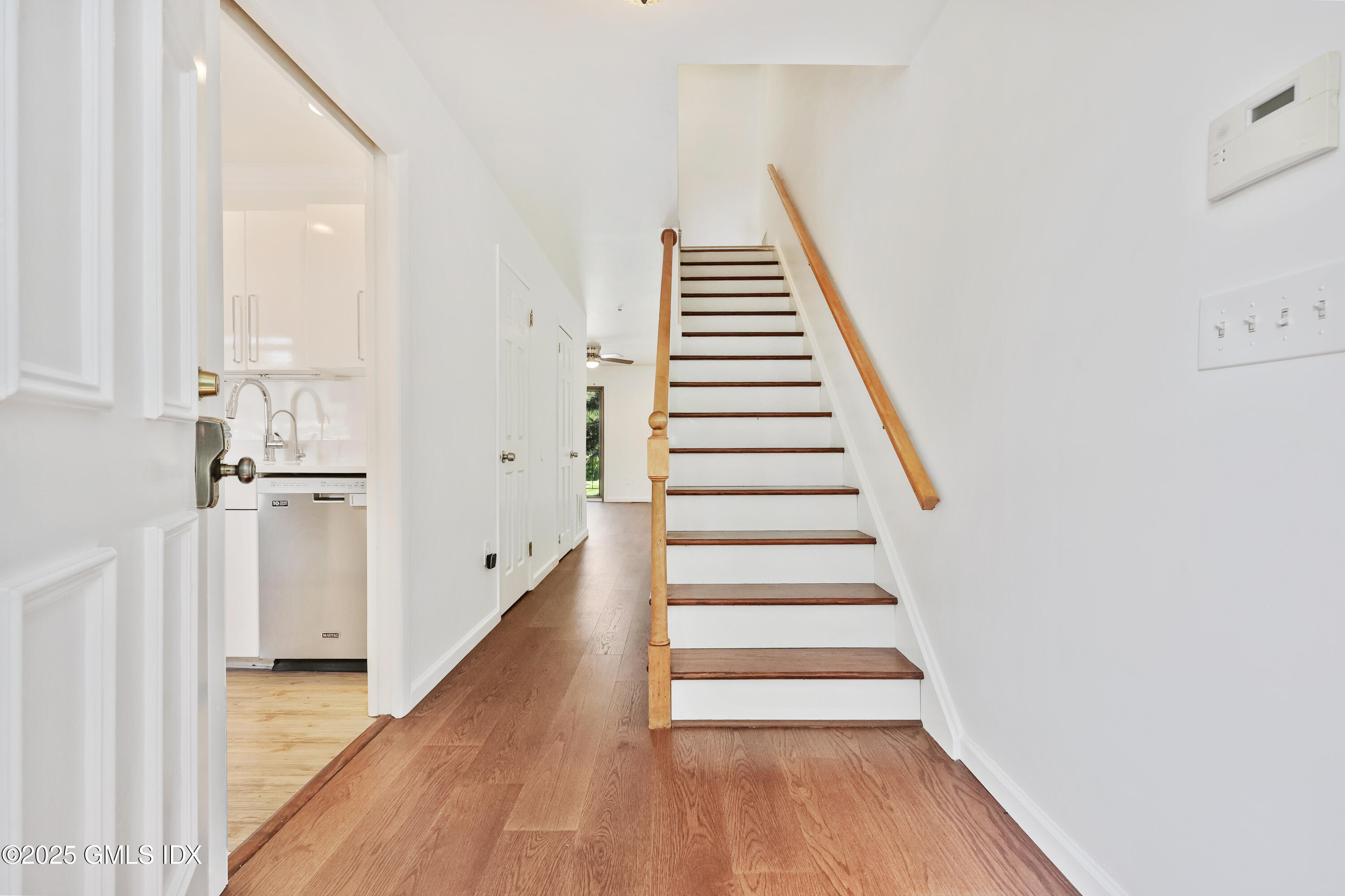 75 Cos Cob Avenue, Unit 14 Cos Cob, CT 06807 - Photo 2 of 28 a view of a room with wooden floor and windows