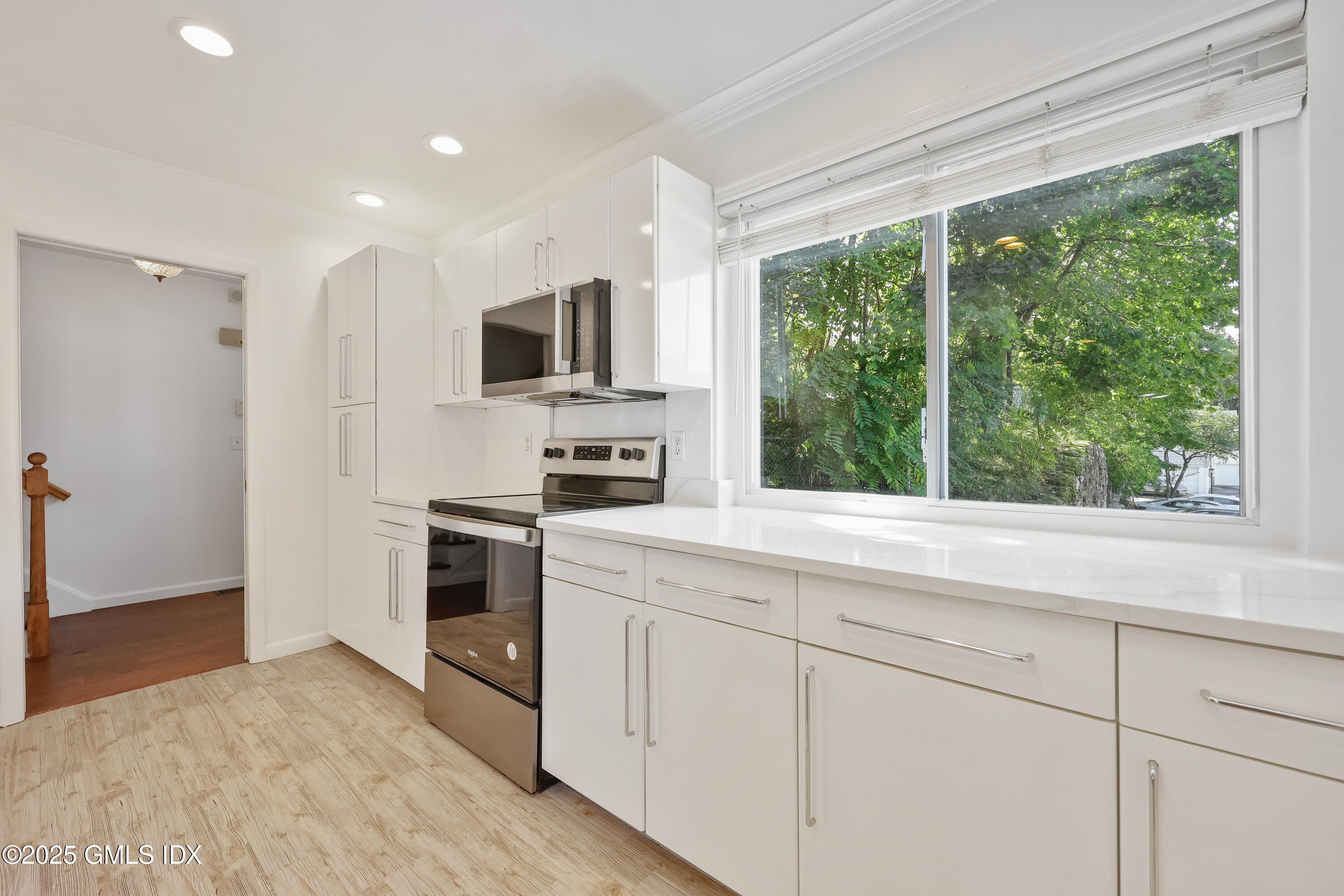 75 Cos Cob Avenue, Unit 14 Cos Cob, CT 06807 - Photo 4 of 28 a kitchen with stainless steel appliances a stove sink and microwave