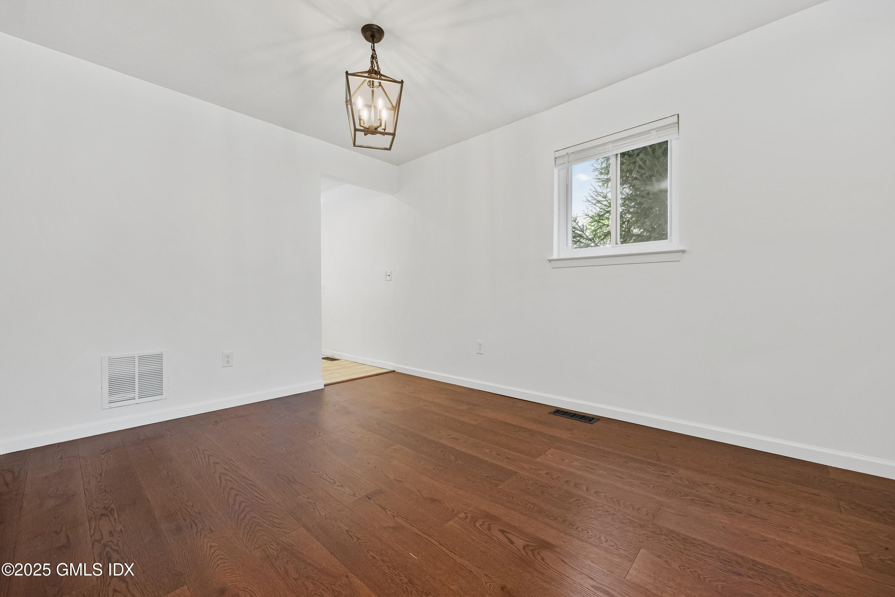 75 Cos Cob Avenue, Unit 14 Cos Cob, CT 06807 - Photo 10 of 28 an empty room with wooden floor and windows