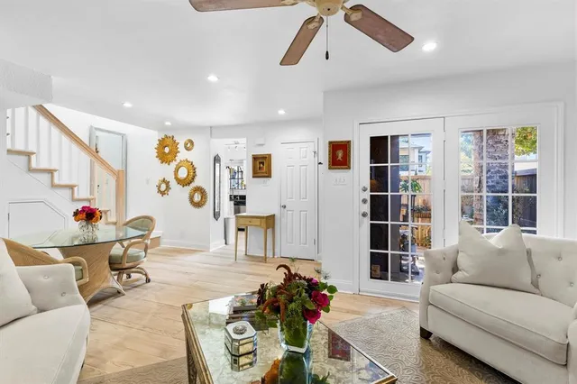 a living room with furniture and white walls