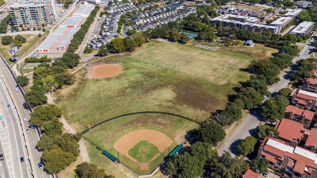 5200 Martel Avenue, Unit 32B Dallas, TX 75206 - Photo 31 of 35 an aerial view of a house with a yard and trees
