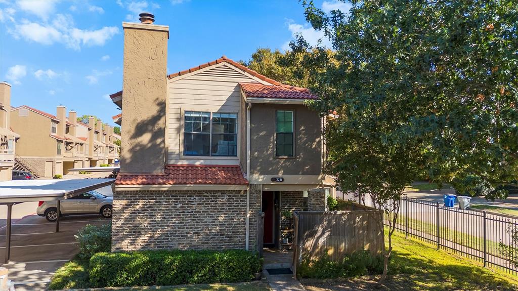 5200 Martel Avenue, Unit 32B Dallas, TX 75206 - Photo 4 of 35 a front view of a house with a garden