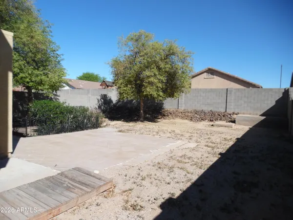 a view of a backyard of the house