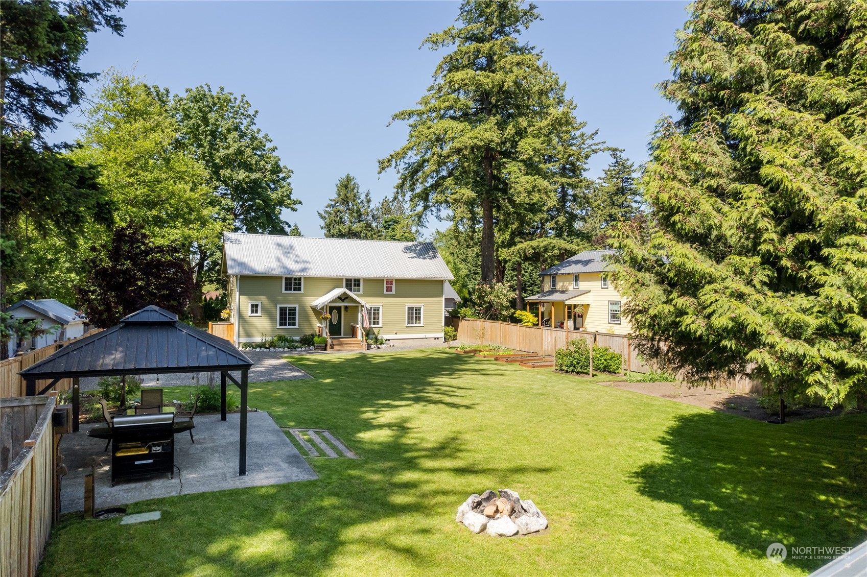 402 West 3rd Street Nooksack, WA 98276 - Photo 12 of 36 a view of a house with garden and sitting area