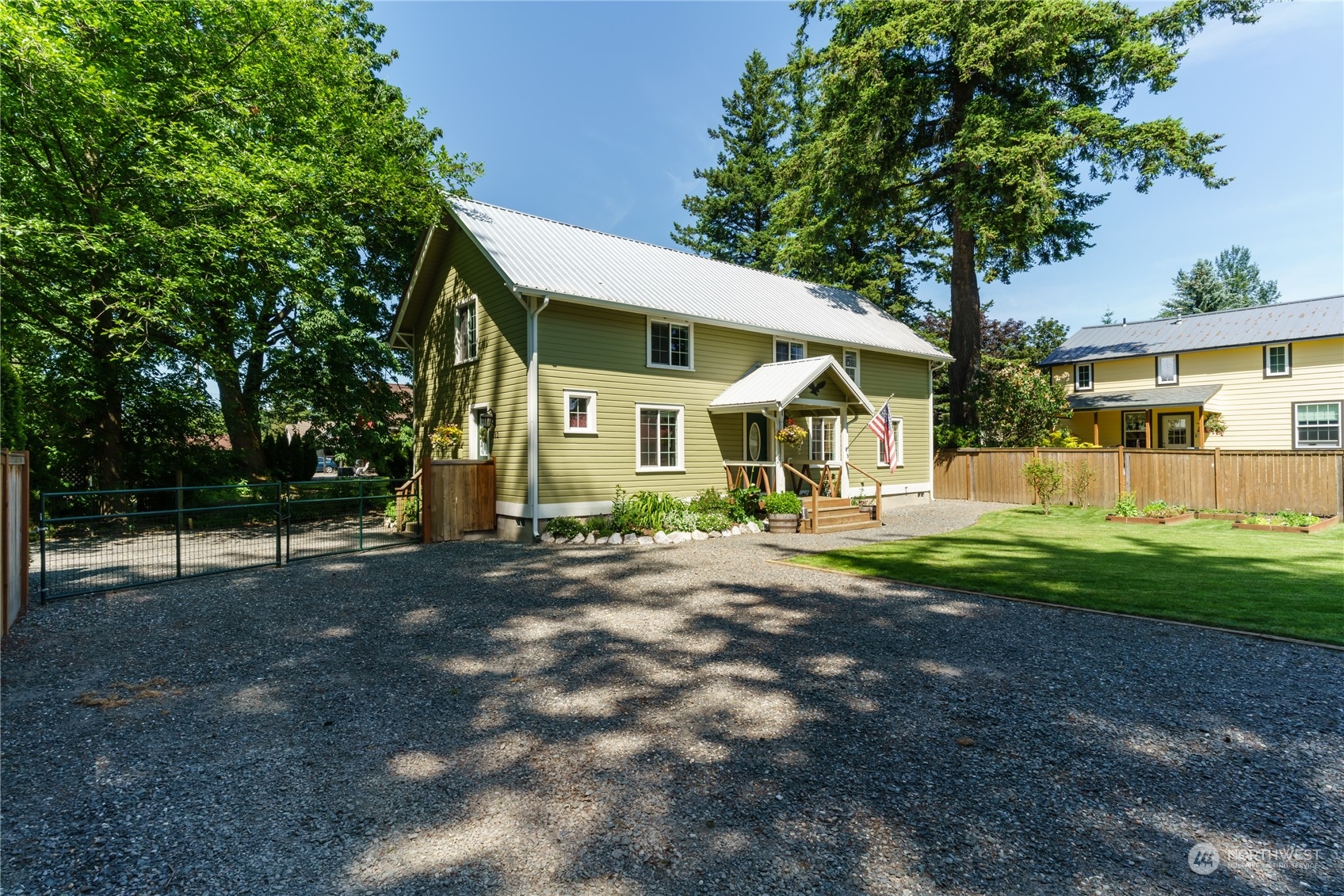 402 West 3rd Street Nooksack, WA 98276 - Photo 2 of 36 a front view of a house with garden