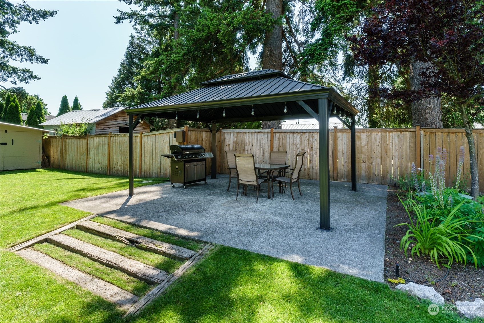 402 West 3rd Street Nooksack, WA 98276 - Photo 5 of 36 a view of backyard with a patio and fire pit