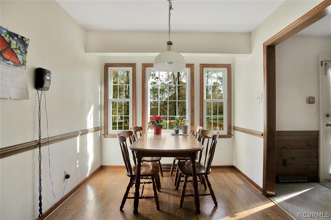 11301 Celtic Road Chesterfield, VA 23838 - Photo 12 of 27 a dining room with furniture window and wooden floor
