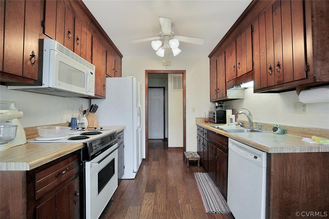 11301 Celtic Road Chesterfield, VA 23838 - Photo 14 of 27 a kitchen with a sink stove and cabinets
