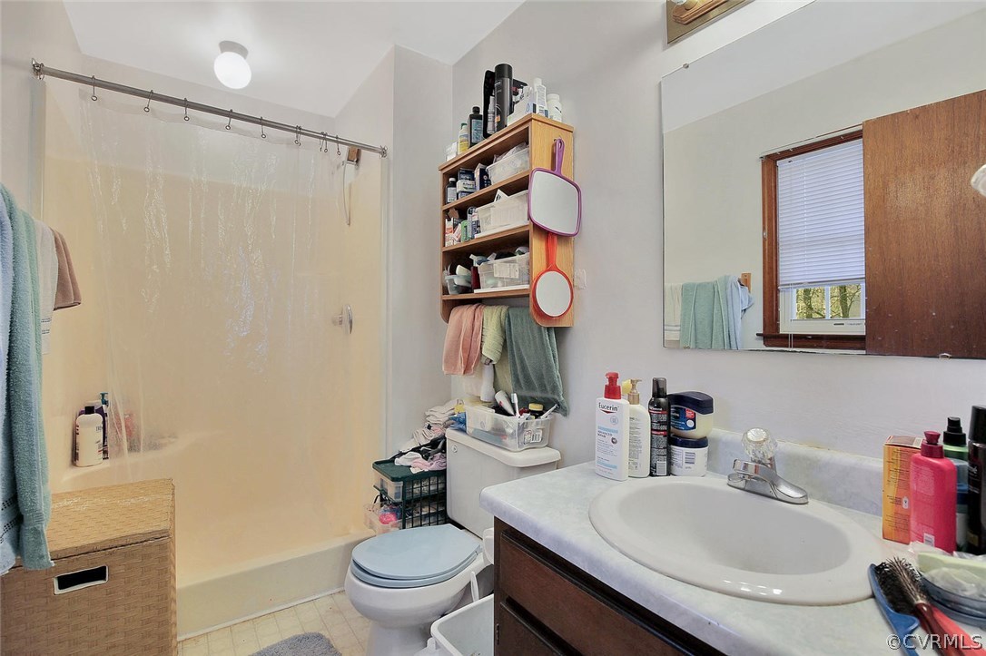 11301 Celtic Road Chesterfield, VA 23838 - Photo 18 of 27 a bathroom with a sink vanity mirror and toilet