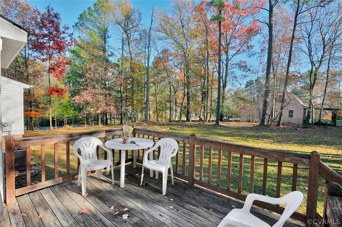 11301 Celtic Road Chesterfield, VA 23838 - Photo 22 of 27 a view of a patio with table and chairs and wooden floor