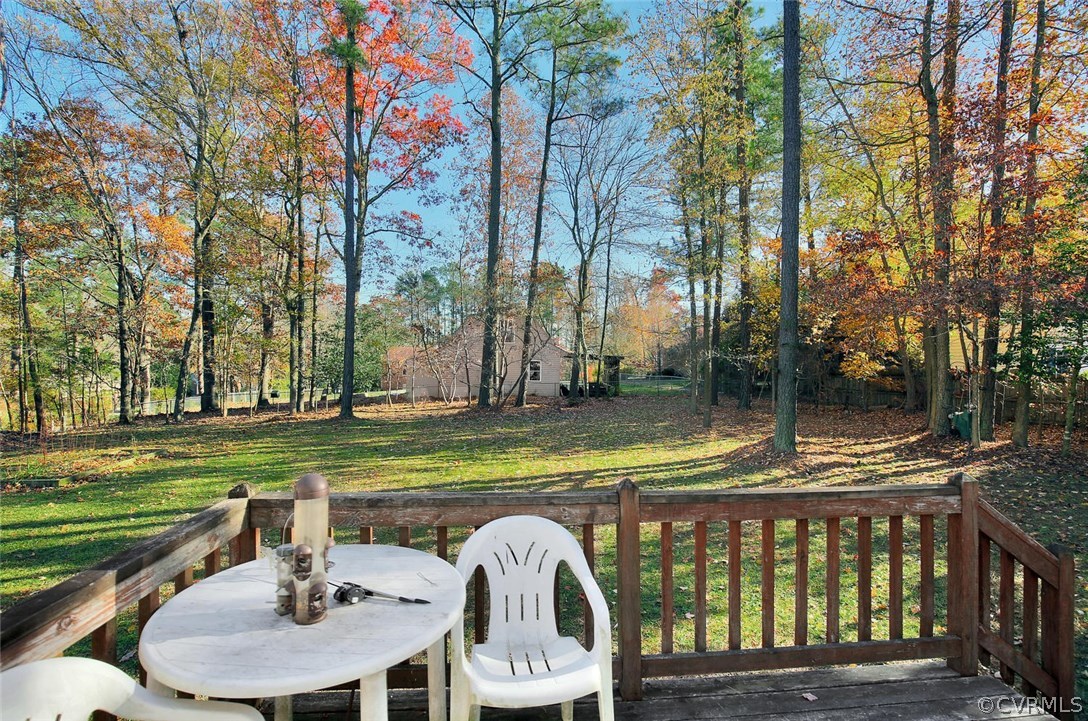 11301 Celtic Road Chesterfield, VA 23838 - Photo 23 of 27 a view of a wooden dinning table and chairs in the patio