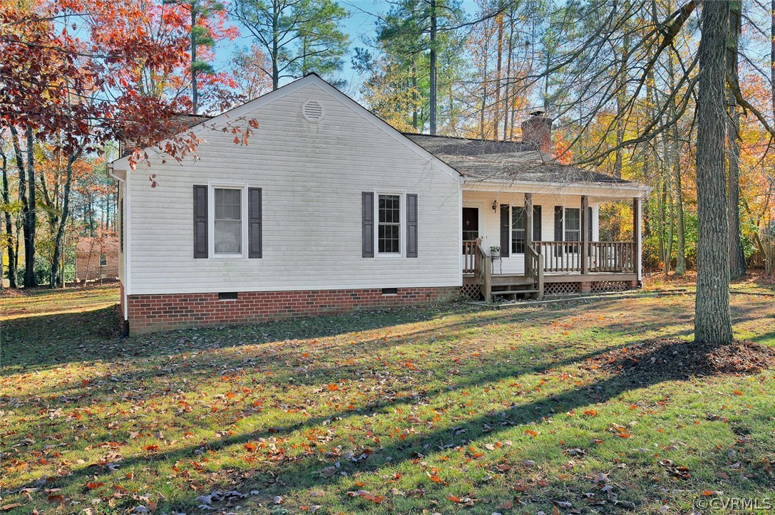 11301 Celtic Road Chesterfield, VA 23838 - Photo 5 of 27 a front view of a house with garden