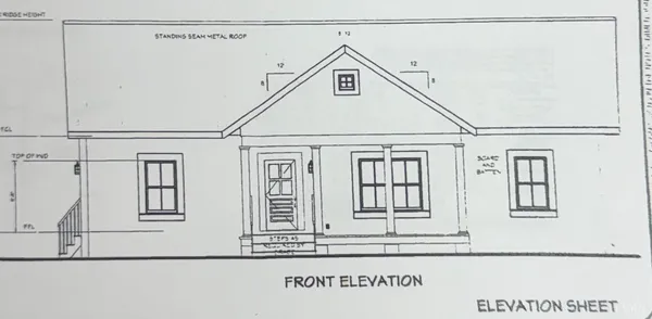 a view of a house with white walls