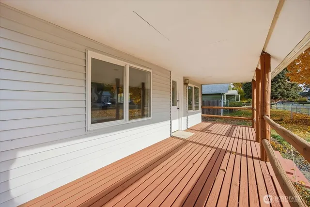 a view of balcony with wooden floor