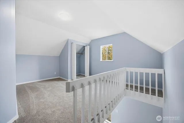 a view of staircase with white walls