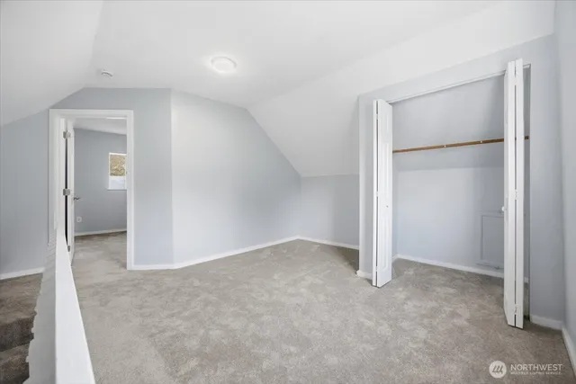 an empty room with closet area