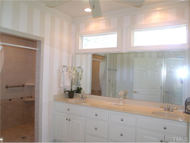 604 Mason Road Durham, NC 27712 - Photo 13 of 25 a bathroom with a double vanity sink and a mirror