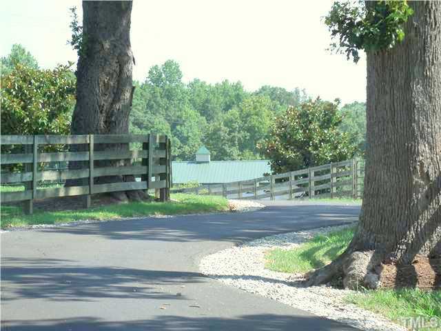 604 Mason Road Durham, NC 27712 - Photo 24 of 25 a backyard of a house with lots of green space