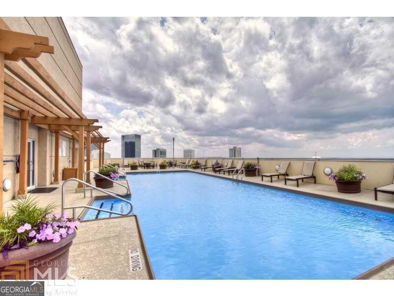 285 Centennial Olympic Park Drive Northwest, Unit 1106 Atlanta, GA 30313 - Photo 31 of 44 a view of a terrace with chairs