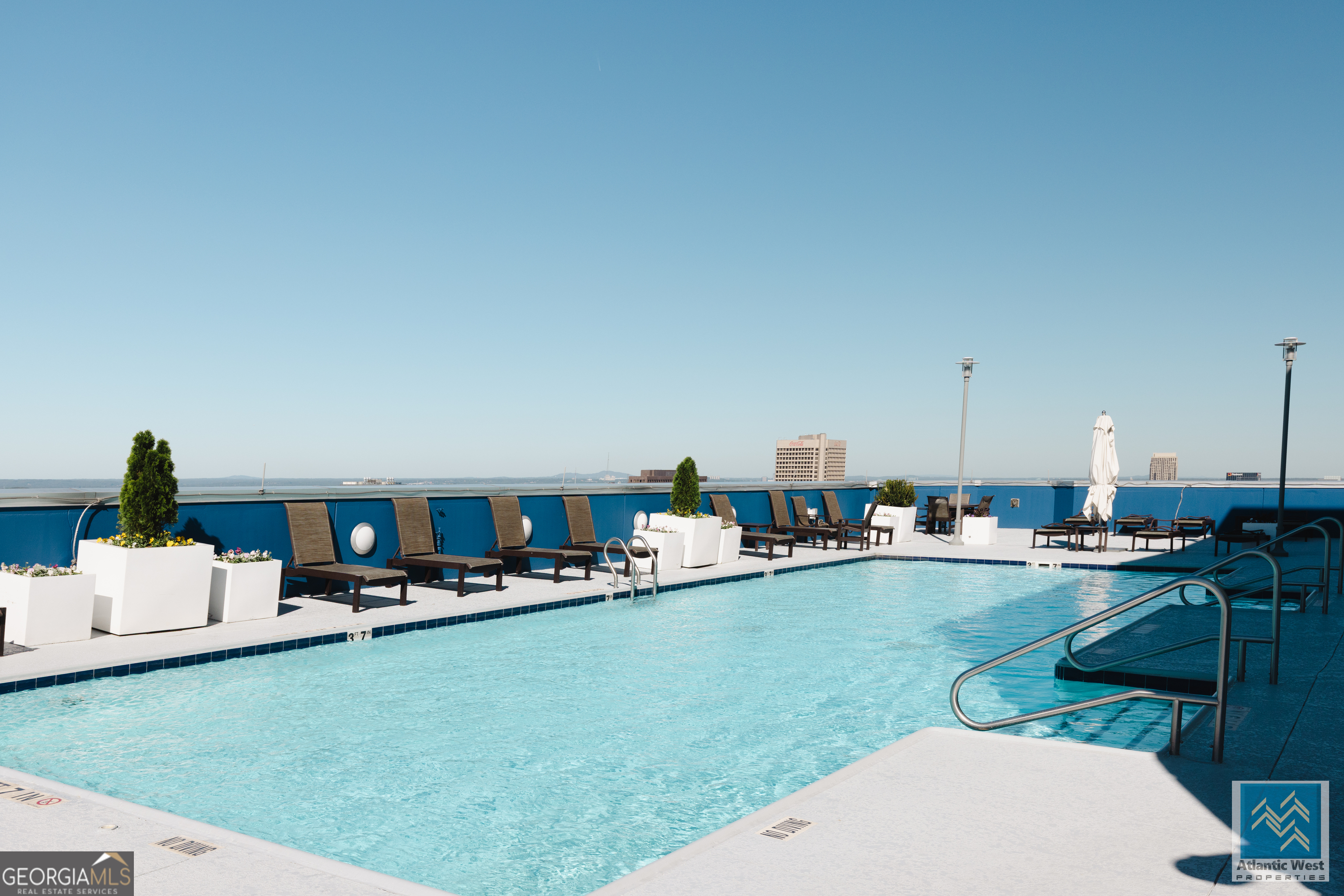 285 Centennial Olympic Park Drive Northwest, Unit 1106 Atlanta, GA 30313 - Photo 37 of 44 a living room with dining room and kitchen view