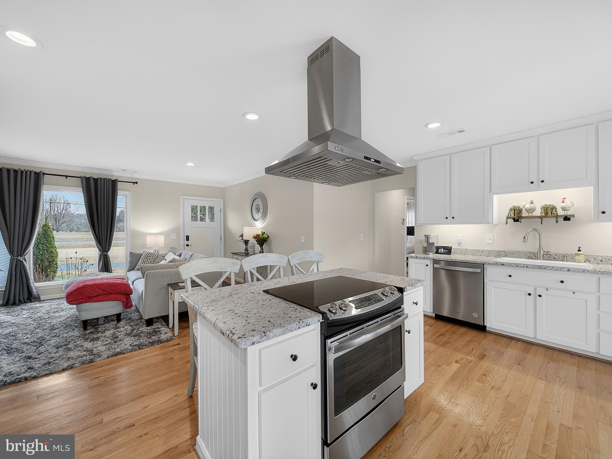 8746 Meetze Road Warrenton, VA 20187 - Photo 11 of 48 a kitchen with granite countertop a sink stainless steel appliances and cabinets