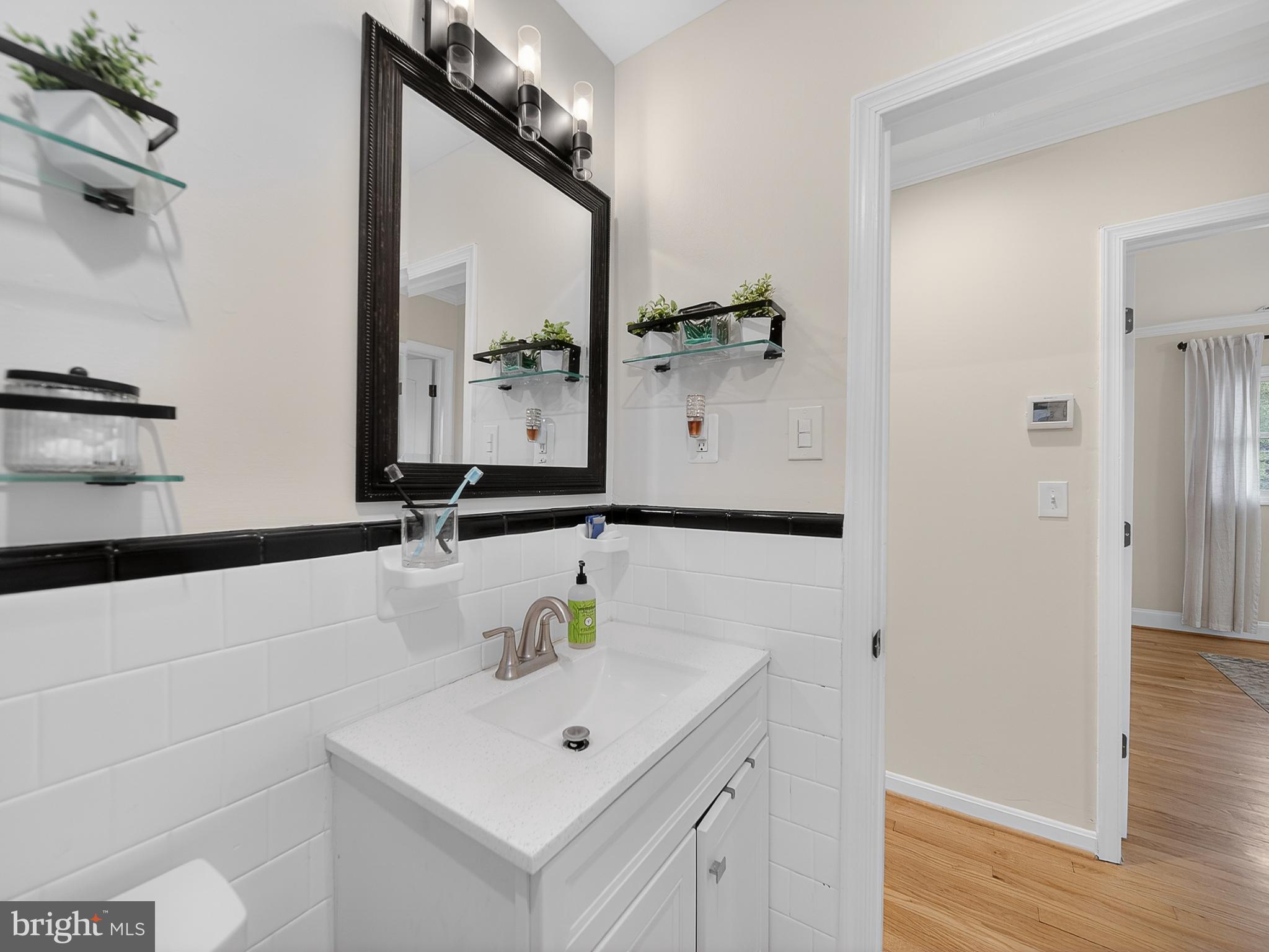 8746 Meetze Road Warrenton, VA 20187 - Photo 25 of 48 a bathroom with a sink and a mirror