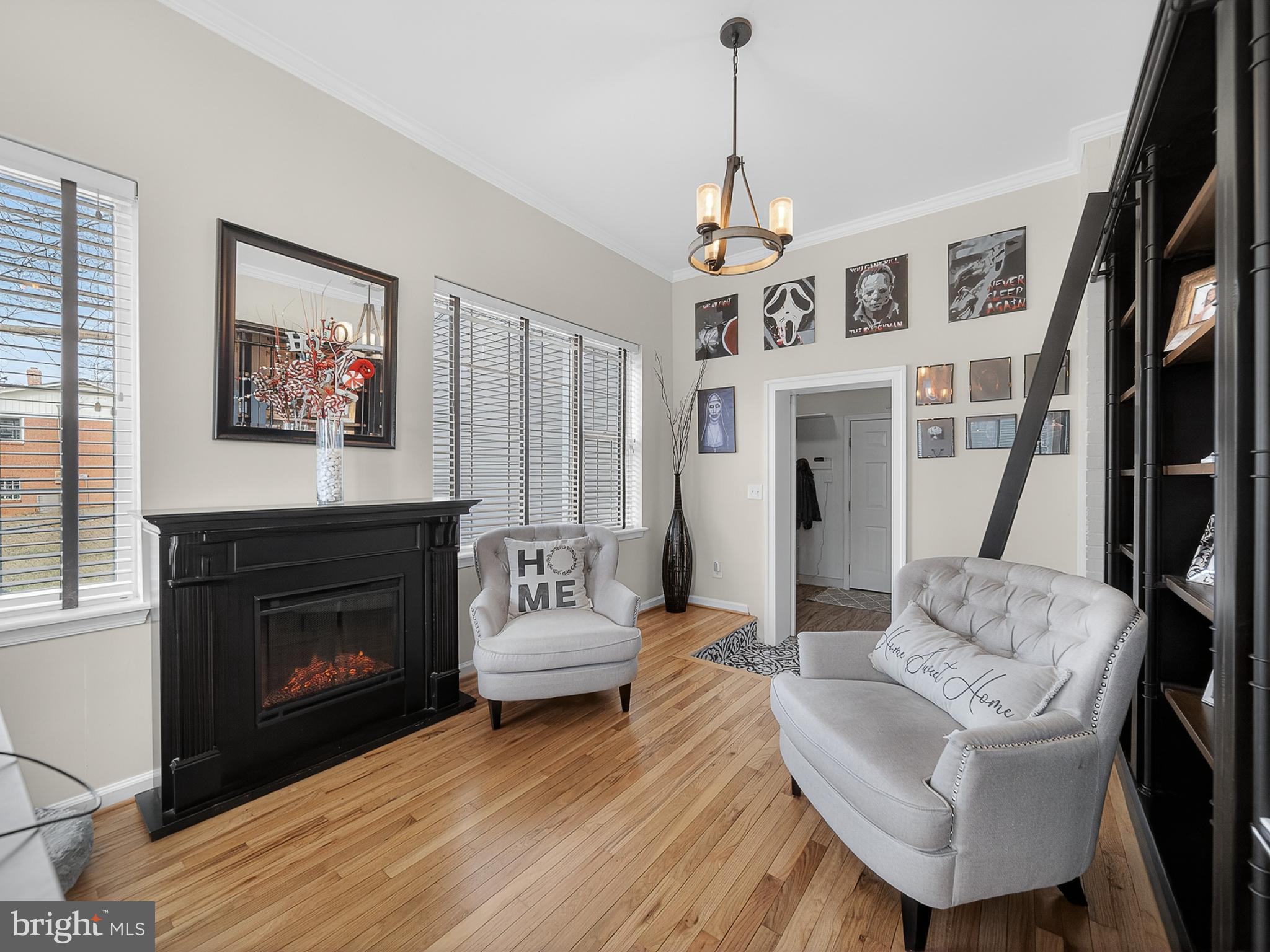 8746 Meetze Road Warrenton, VA 20187 - Photo 27 of 48 a living room with furniture a fireplace and a flat screen tv