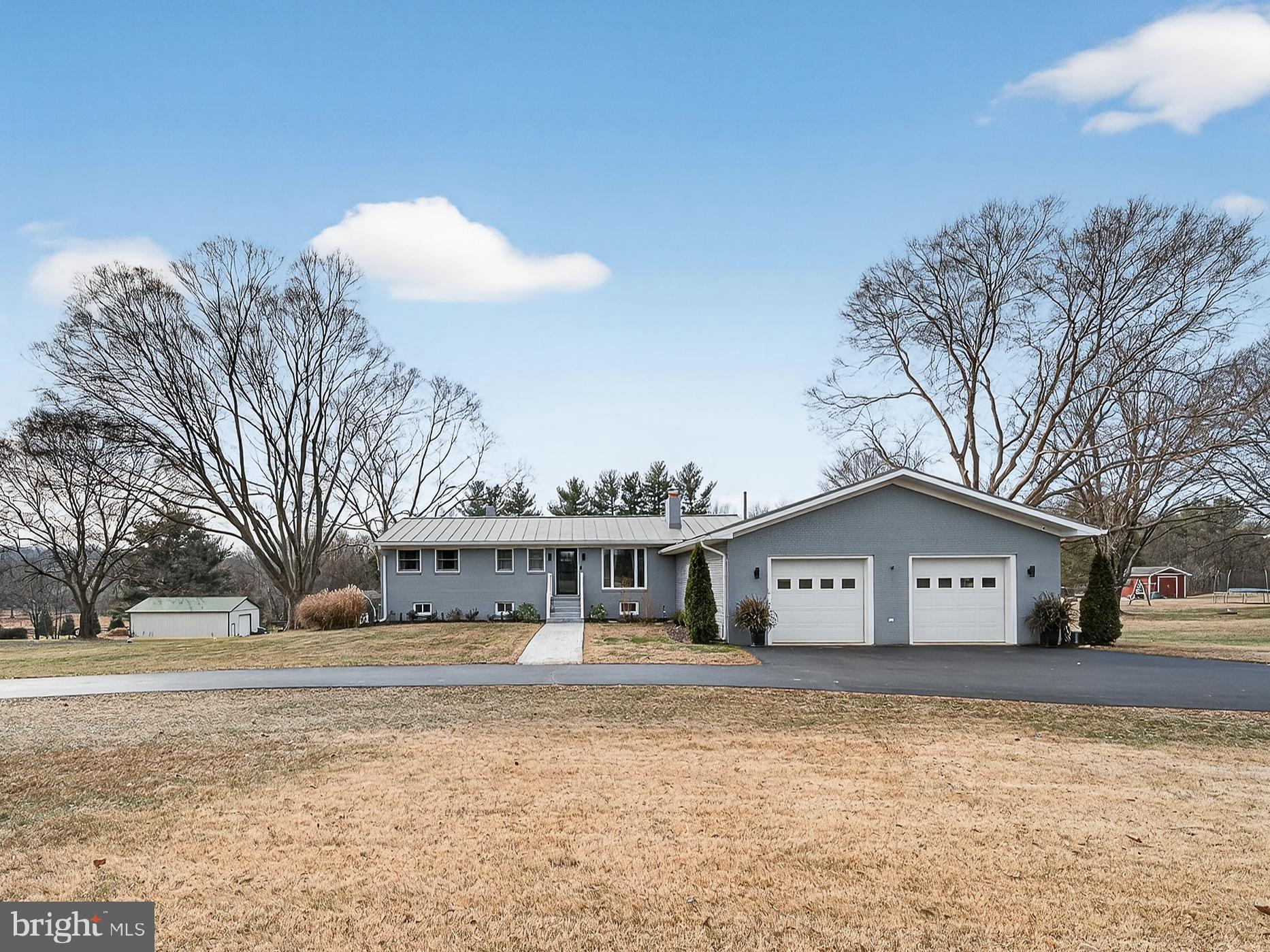 8746 Meetze Road Warrenton, VA 20187 - Photo 3 of 48 a view of a house with a snow in the yard