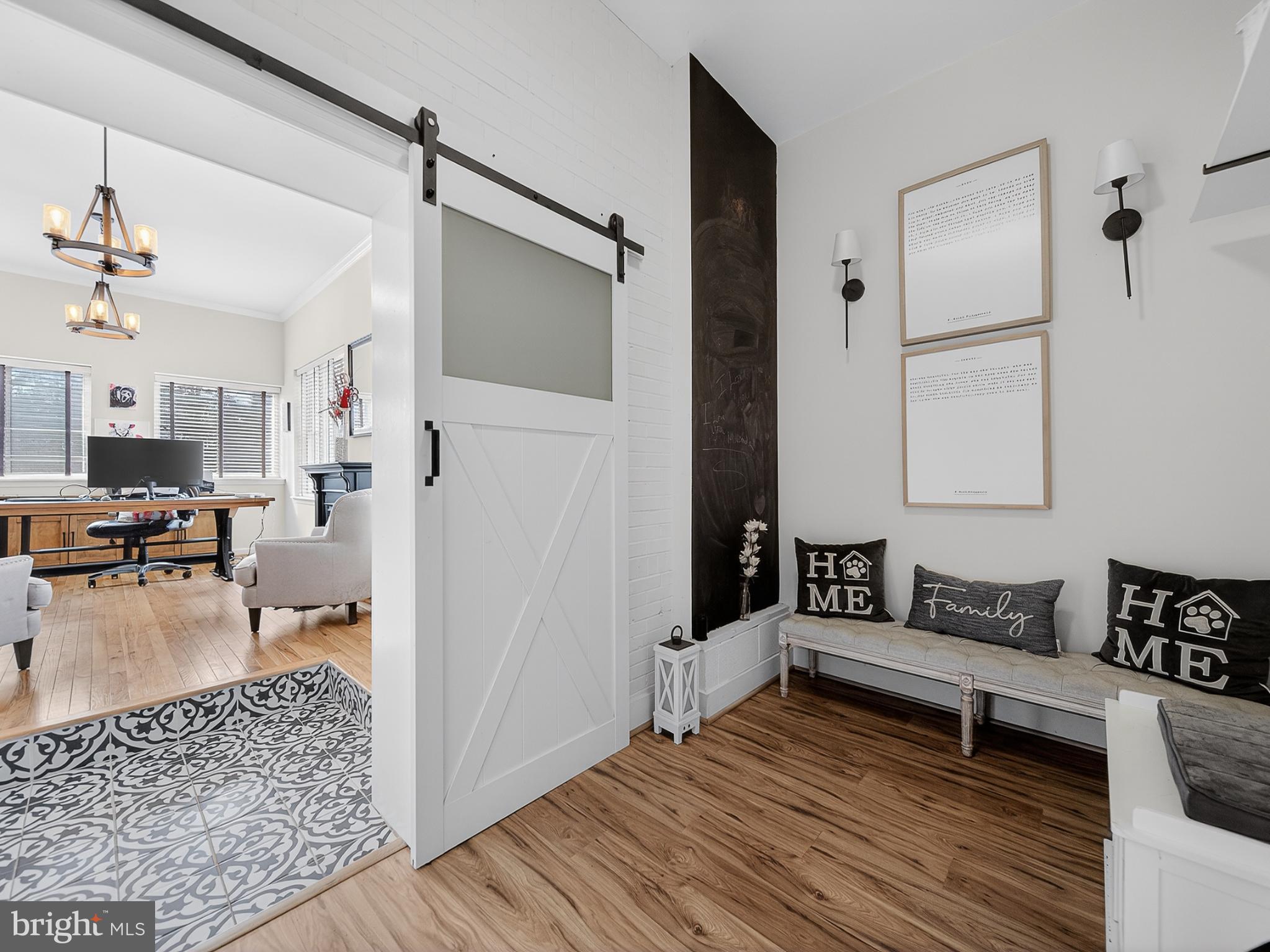 8746 Meetze Road Warrenton, VA 20187 - Photo 31 of 48 a living room with furniture and a wooden floor