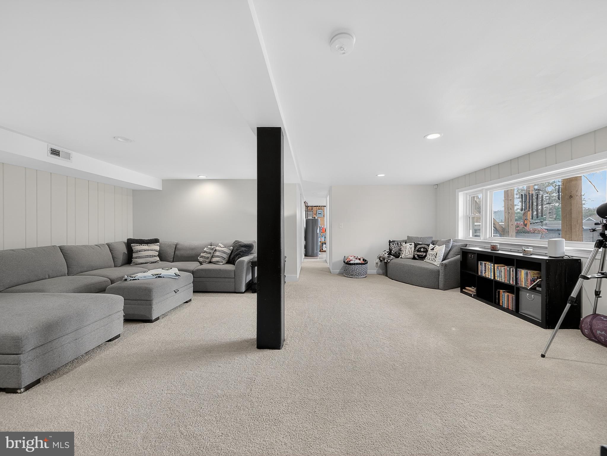 8746 Meetze Road Warrenton, VA 20187 - Photo 35 of 48 a living room with furniture and a flat screen tv