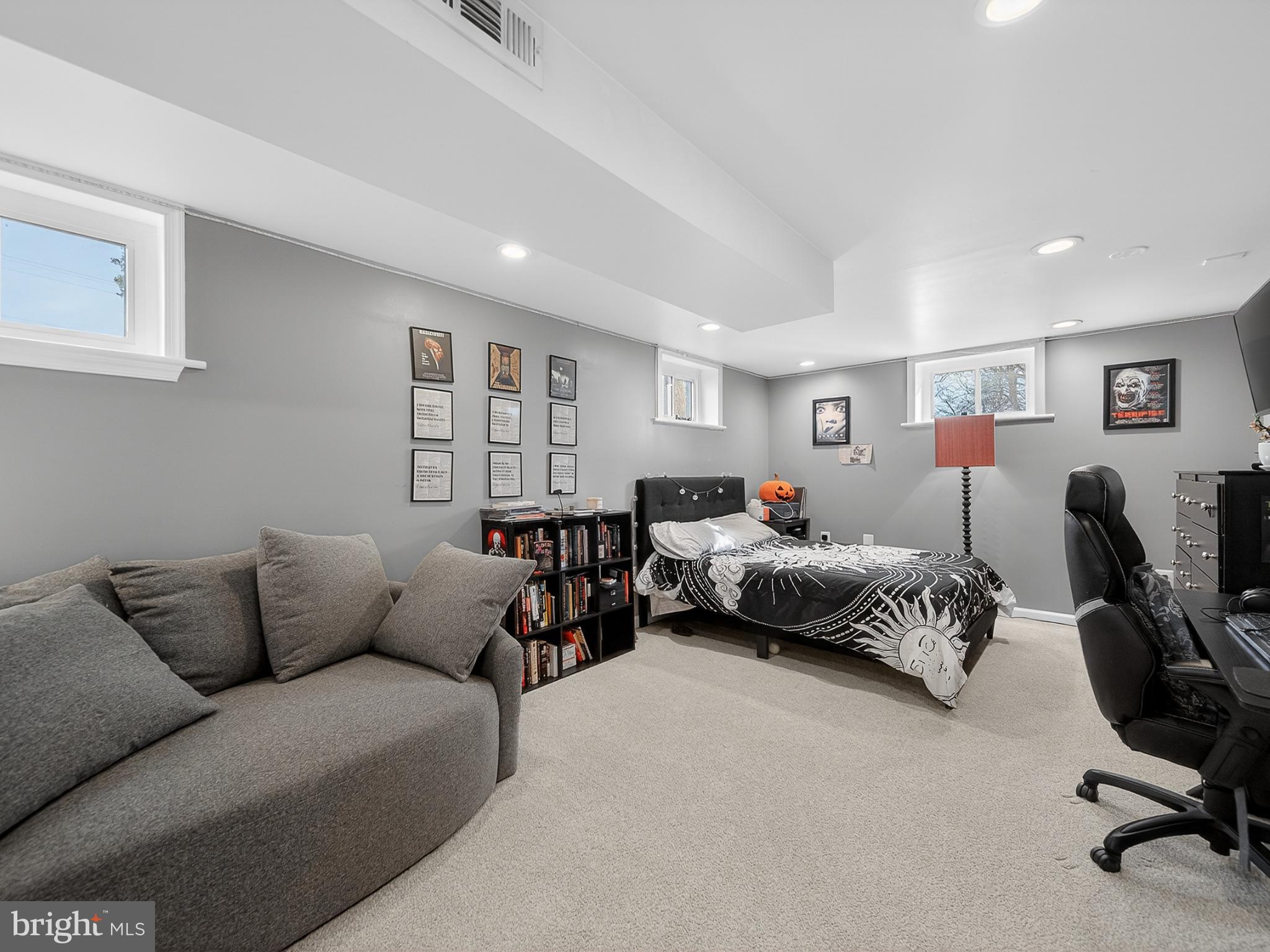 8746 Meetze Road Warrenton, VA 20187 - Photo 36 of 48 a bedroom with furniture and a couch