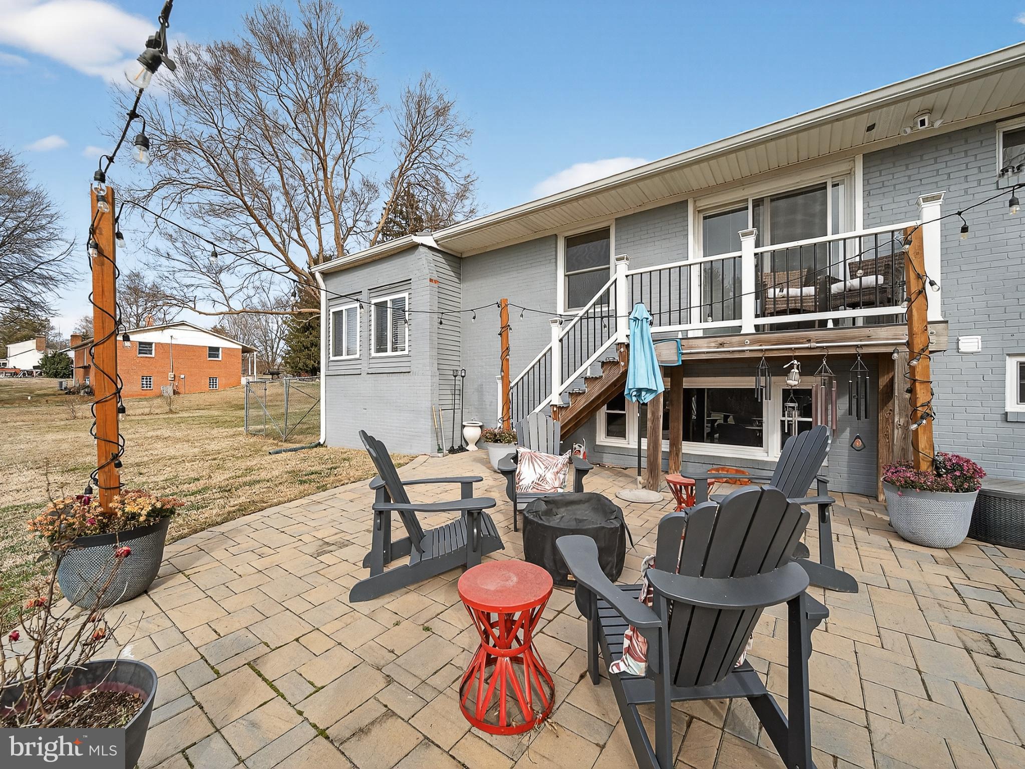 8746 Meetze Road Warrenton, VA 20187 - Photo 42 of 48 a backyard of a house with barbeque oven table and chairs