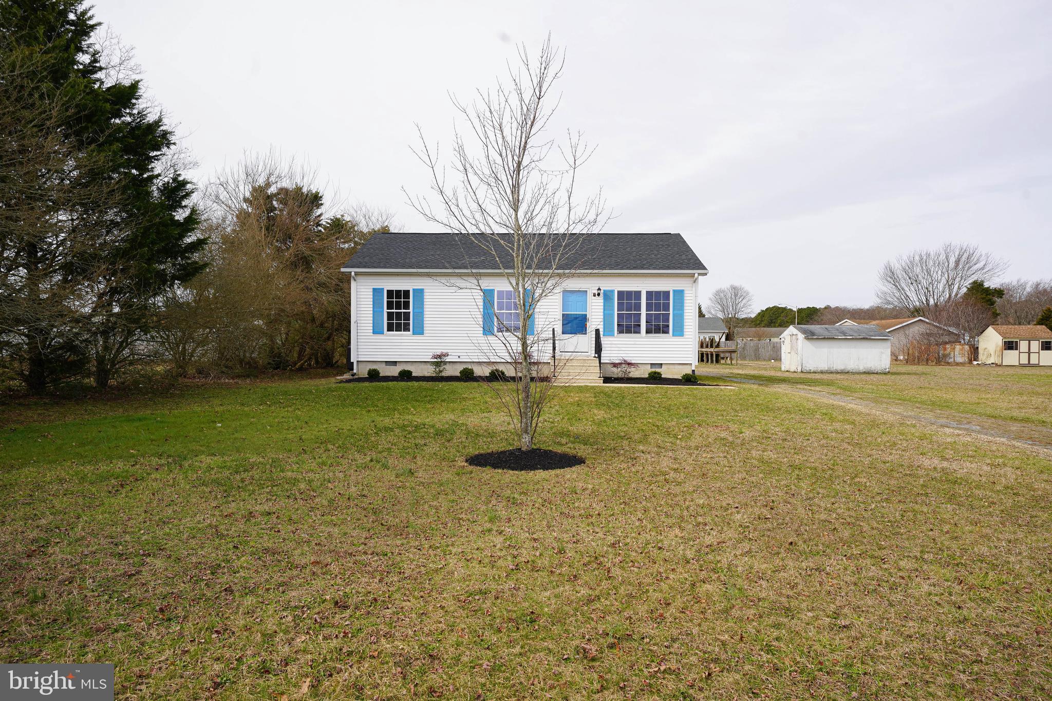 7526 Bethel Road Willards, MD 21874 - Photo 32 of 34 a front view of a house with a yard