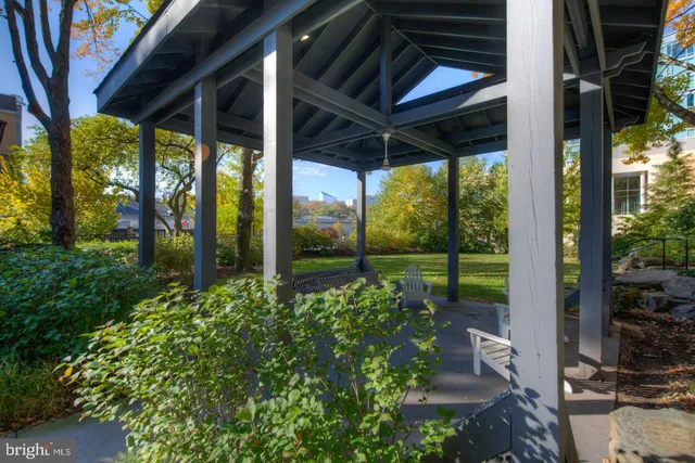 a view of a porch with furniture and garden