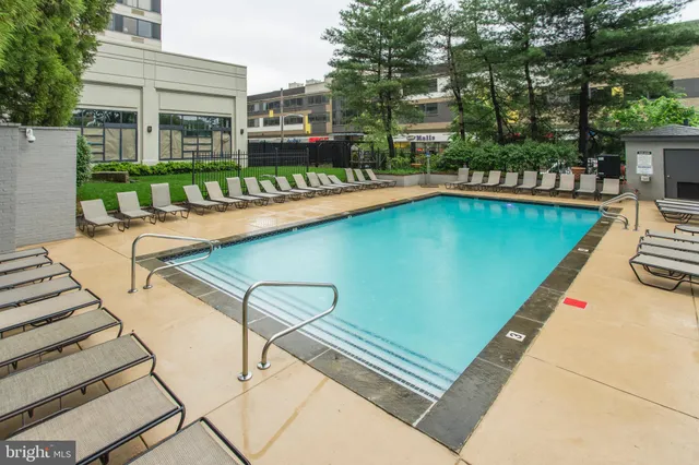a view of a swimming pool with a patio