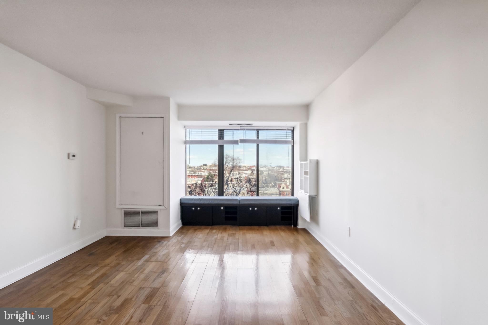 2001 Hamilton Street, Unit 927 Philadelphia, PA 19130 - Photo 3 of 26 a view of room with window and hardwood floor