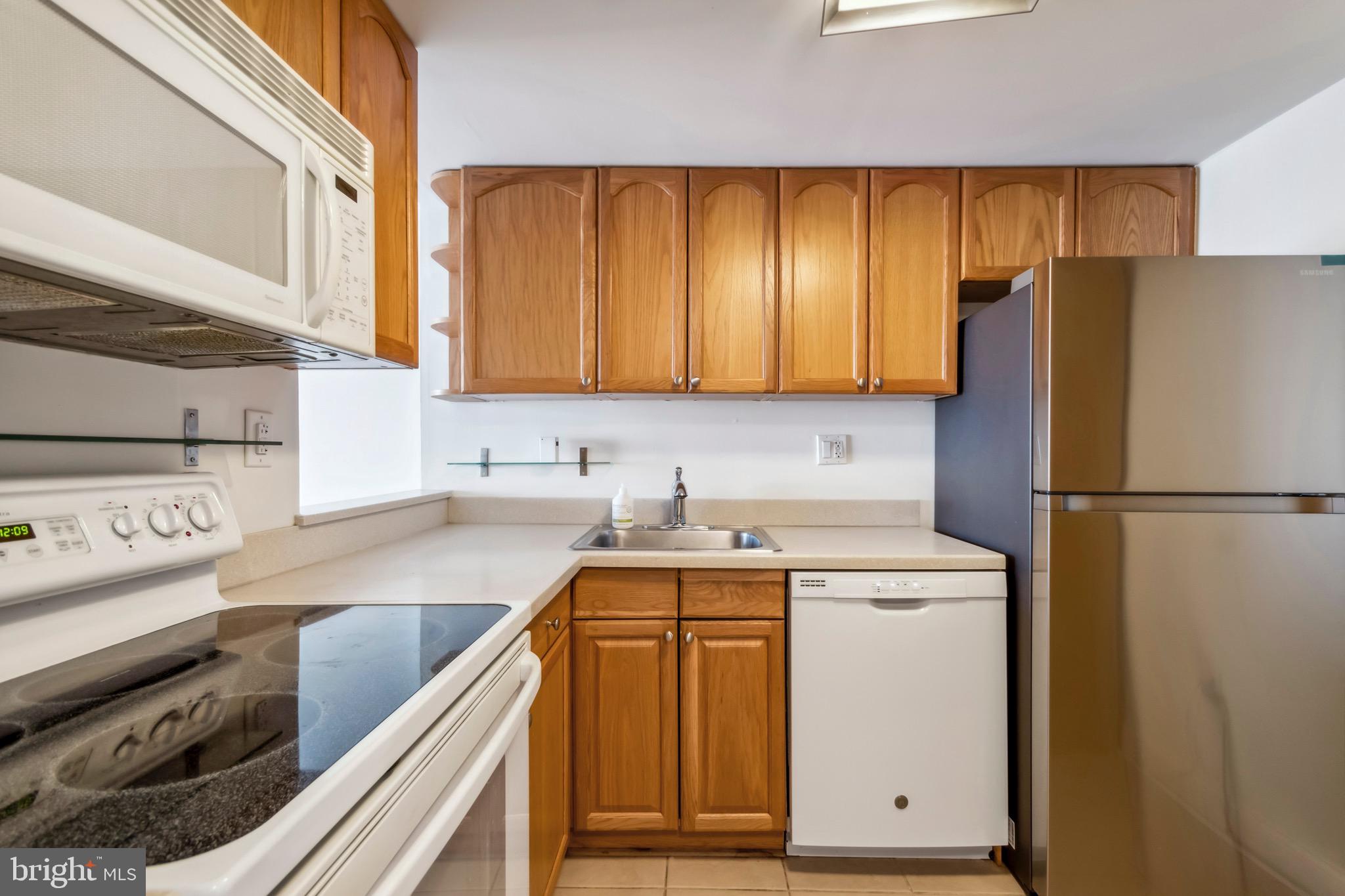 2001 Hamilton Street, Unit 927 Philadelphia, PA 19130 - Photo 8 of 26 a kitchen with a refrigerator stove and sink