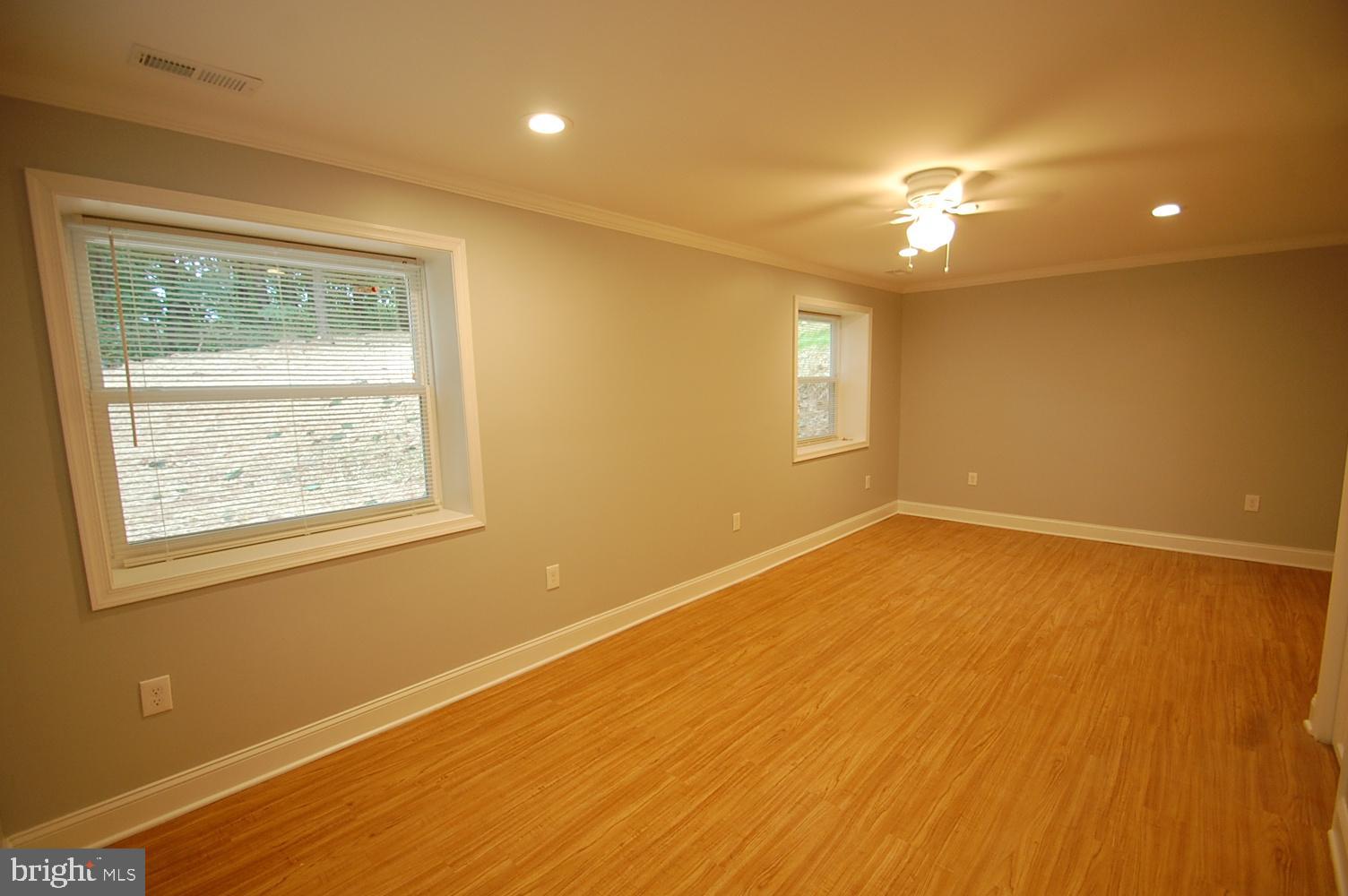1940 Nelson Mill Road Jarrettsville, MD 21084 - Photo 5 of 8 a view of an empty room with wooden floor and a window