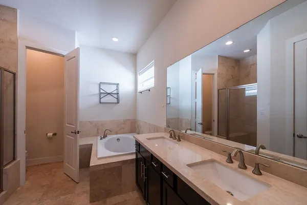 a bathroom with a granite countertop sink mirror and double