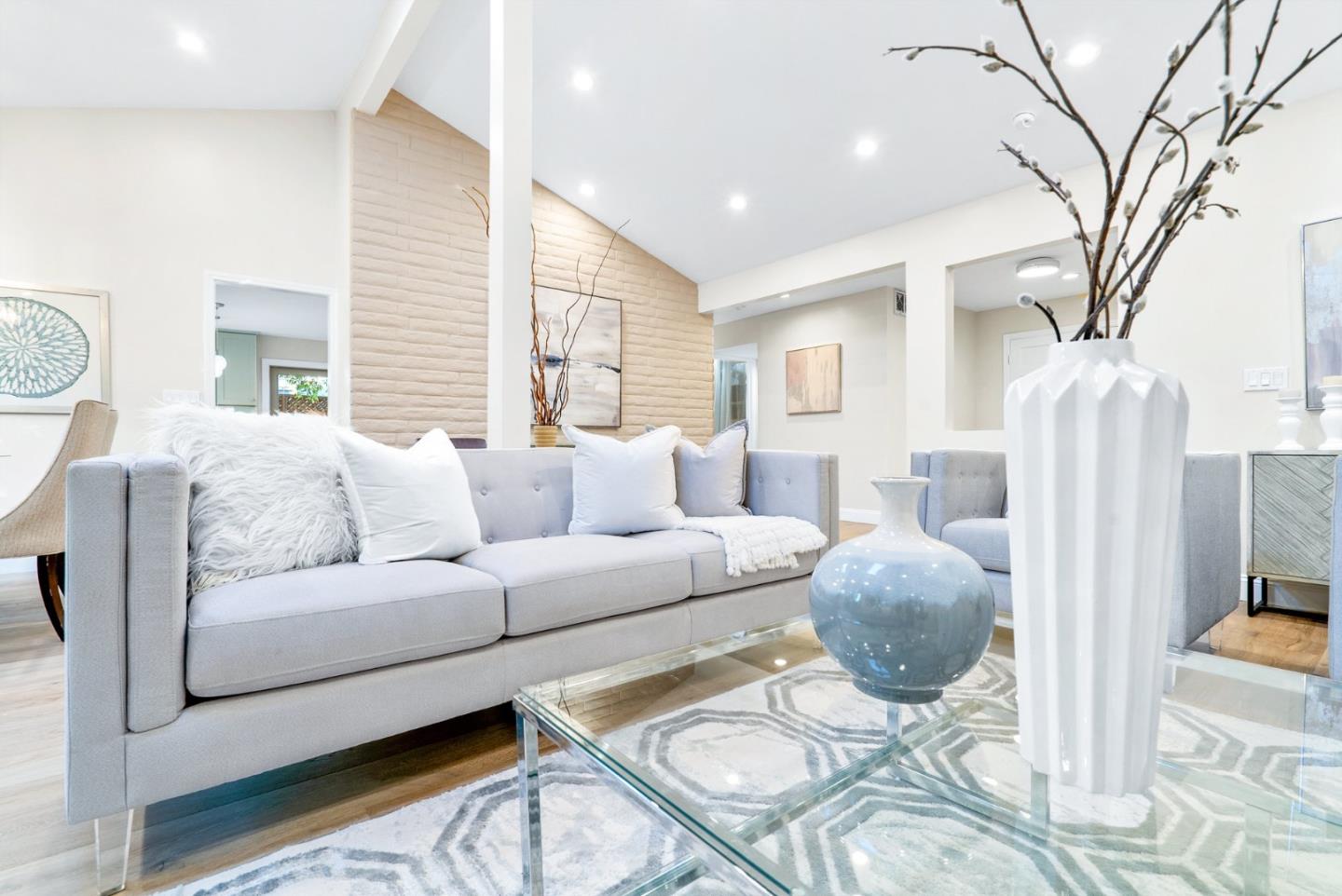 777 Rustic Lane Mountain View, CA 94040 - Photo 11 of 44 a living room with furniture and a fireplace