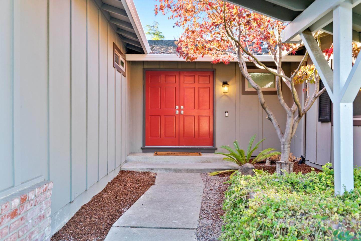 777 Rustic Lane Mountain View, CA 94040 - Photo 3 of 44 a front view of a house with a yard